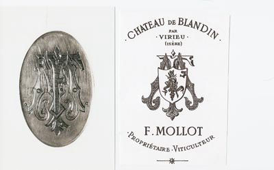 Fortuné Mollot family crest and his logo as a wine producerFortuné Mollot family crest and his logo as a wine producer